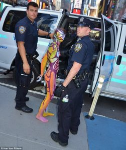 Nude Model Zoe West Arrested during a public body painting exhibition by Andy Golub